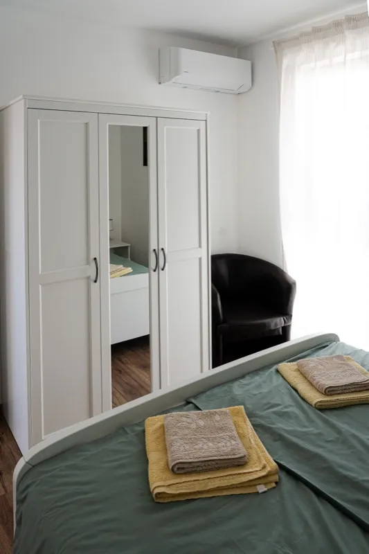 Double bedroom with wardrobe and air conditioning